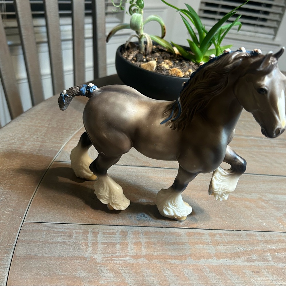 Breyer dapple grey Shire with blue and white mane and tail ribbons